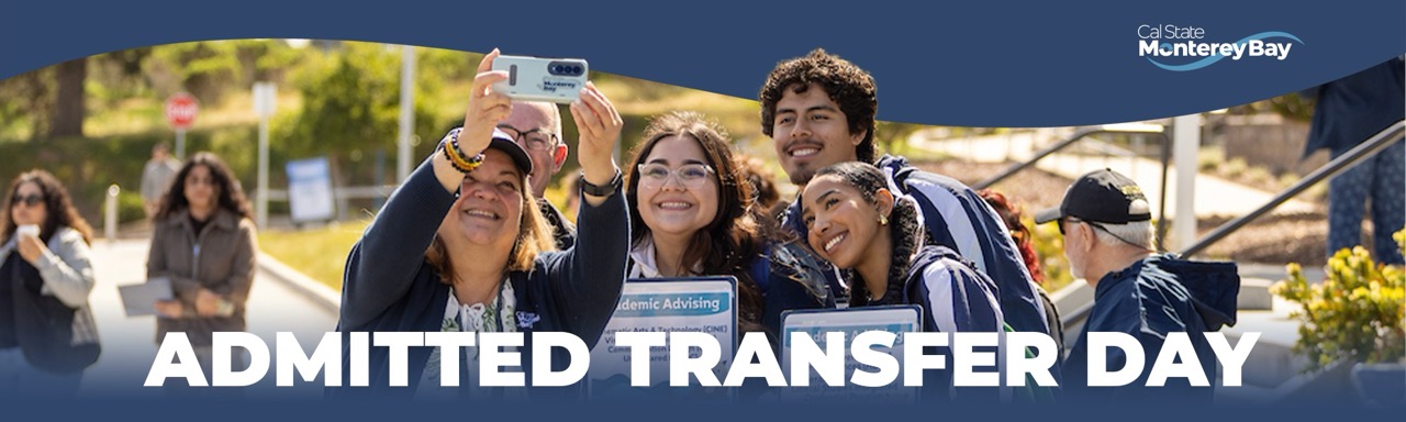 Four people taking a selfie, wearing CSUMB gear